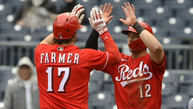 Sep 28, 2022; Pittsburgh, Pennsylvania, USA; Cincinnati Reds third baseman Spencer Steer (12) congratulates designated hitter Kyle Farmer (17) on his two run home run against the Pittsburgh Pirates during the ninth inning at PNC Park. The Pirates won 4-3 in ten innings.Mandatory Credit: Charles LeClaire-USA TODAY Sporth